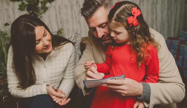 Girl Writing her Christmas list to Santa 